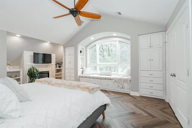 a white bath tub sitting next to a white toilet