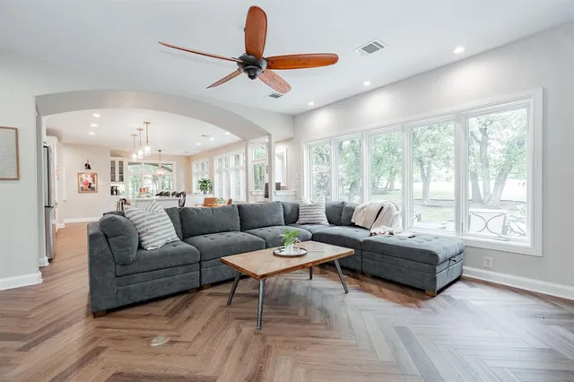 a living room with furniture and a large window