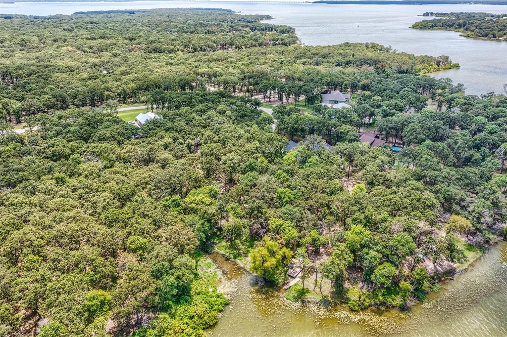 Lot 68 Anchor Point Quinlan, TX 75474 - Photo 8 of 16 Drone / aerial view of a nearby body of water and a heavily wooded area