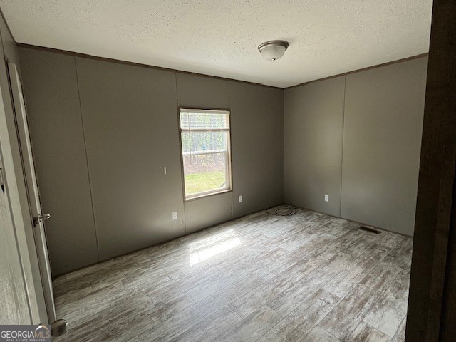 26 Ebenezer Church Road Swainsboro, GA 30401 - Photo 9 of 11 an empty room with windows
