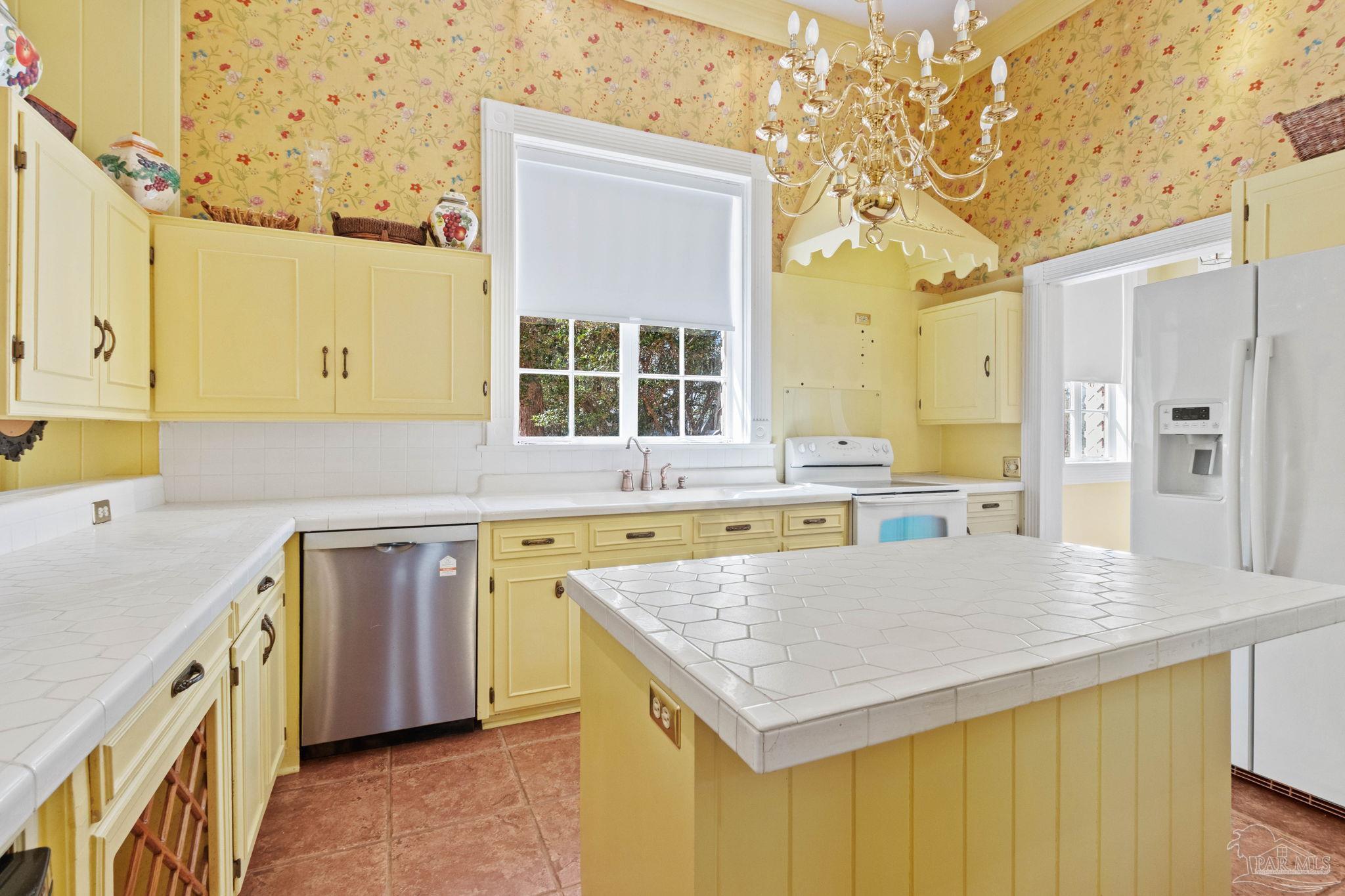 1701 Sowell Road Brewton, AL 36426 - Photo 35 of 72 a kitchen with a stove a sink a refrigerator and a oven