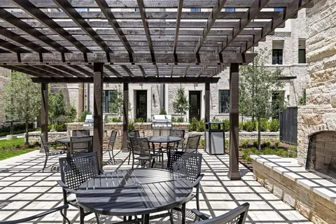 a view of a building with cars parked