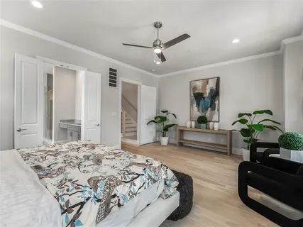 a spacious bathroom with a glass shower door and a bathtub