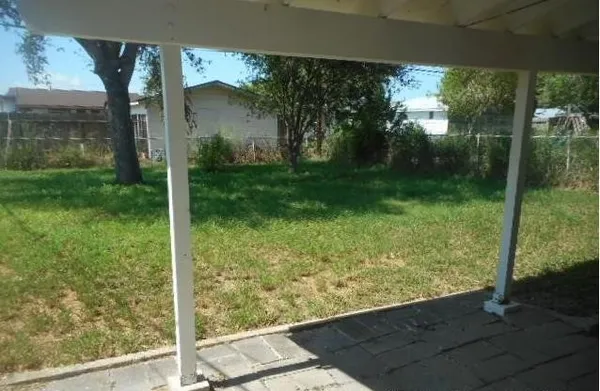 a view of a back yard from a room