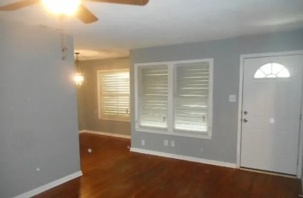 a view of an empty room with a window
