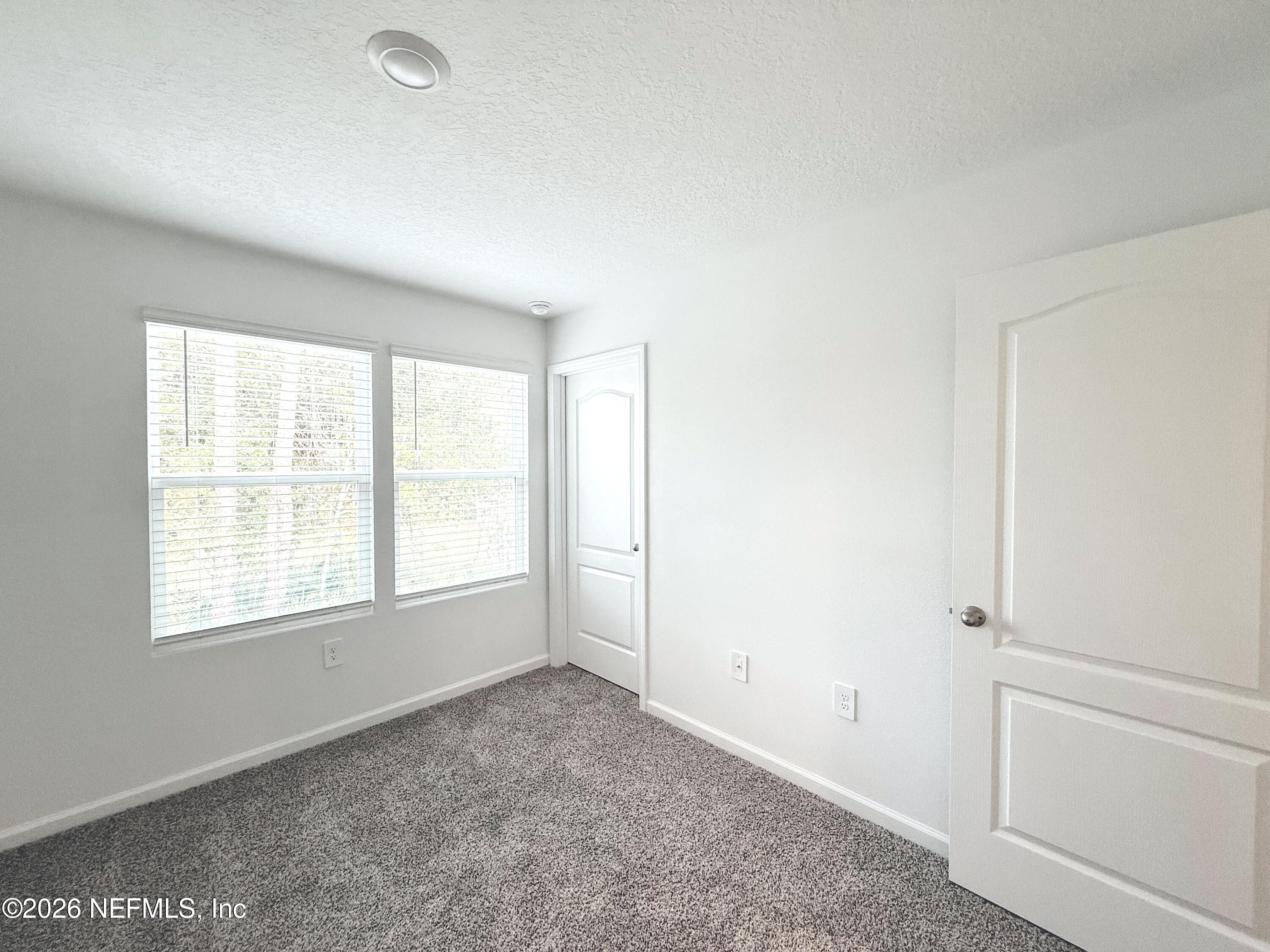 131 Palmetto Rdg Road St. Augustine, FL 32095 - Photo 12 of 22 an empty room with windows