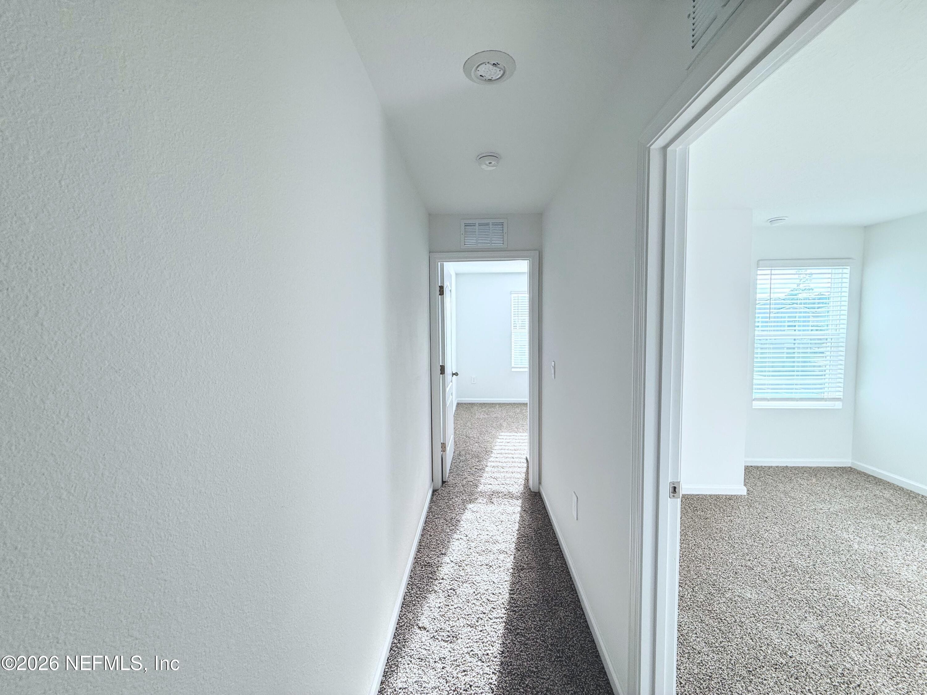 131 Palmetto Rdg Road St. Augustine, FL 32095 - Photo 12 of 20 a view of a hallway with a white walls