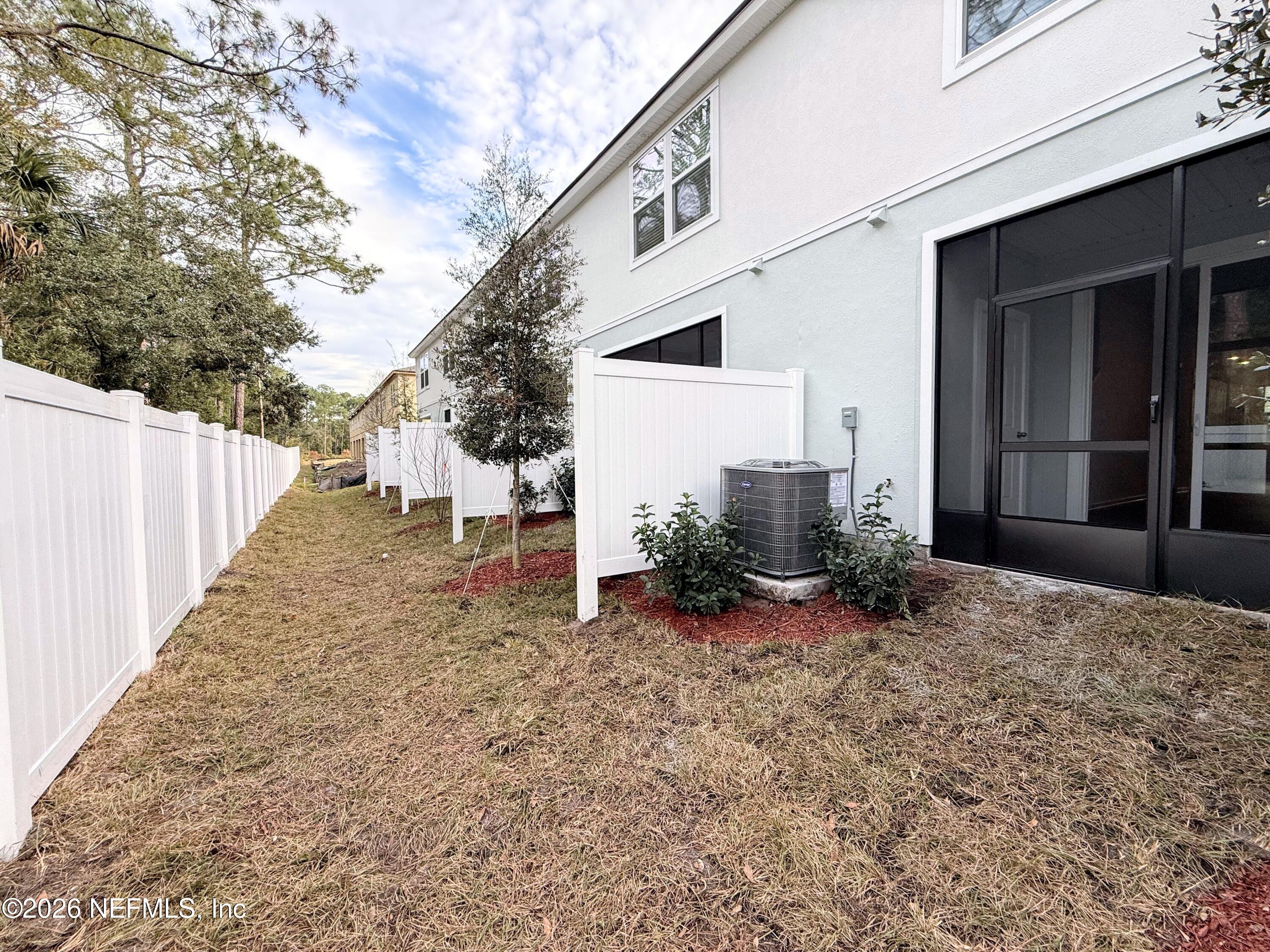 131 Palmetto Rdg Road St. Augustine, FL 32095 - Photo 16 of 20 a view of a house with backyard and trees