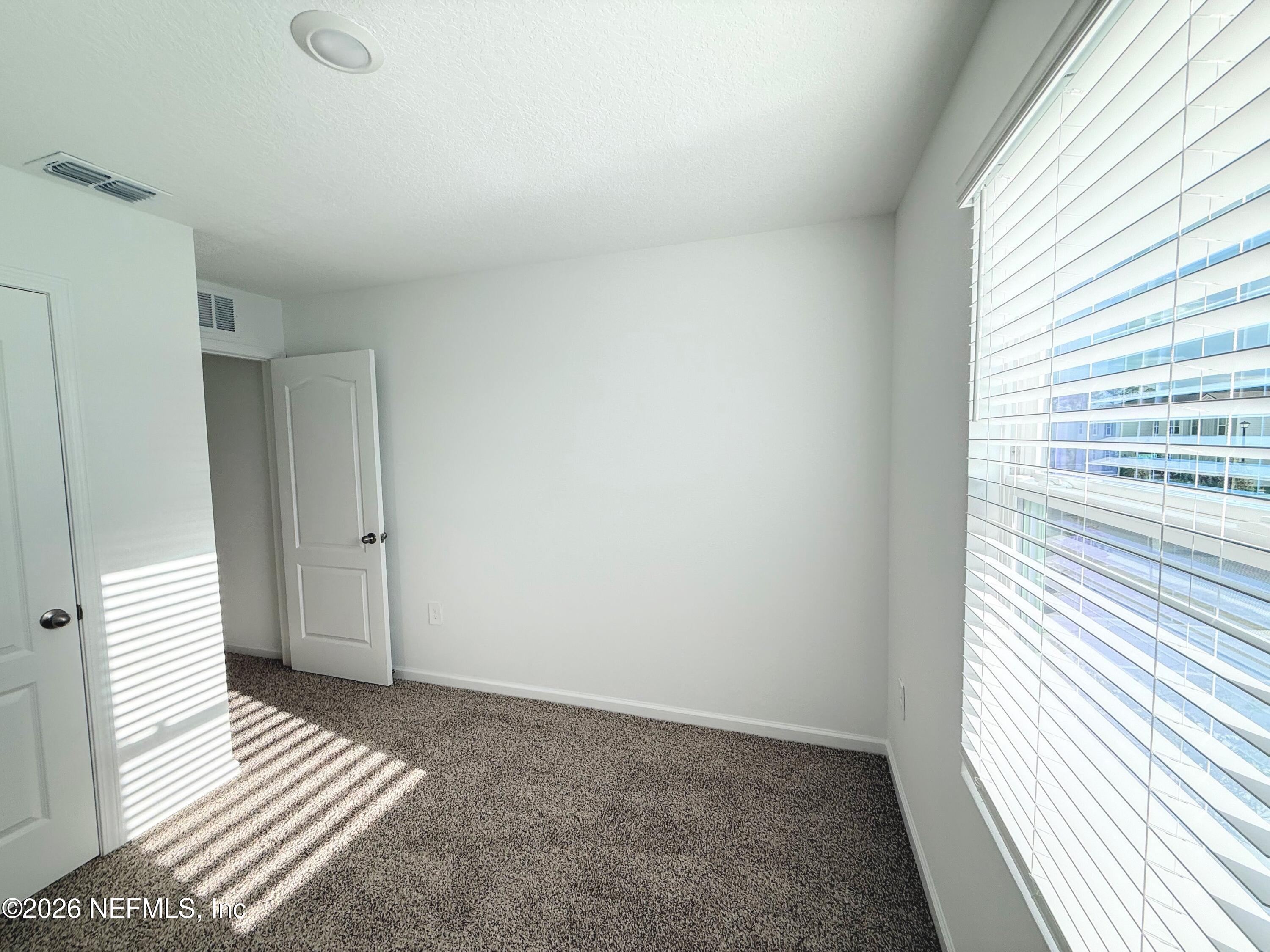 131 Palmetto Rdg Road St. Augustine, FL 32095 - Photo 17 of 22 a view of wooden floor and windows in a room