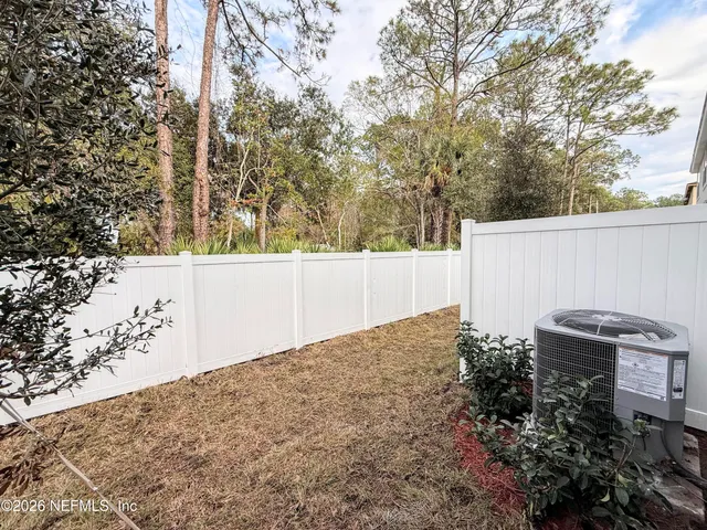 a backyard of a house with lots of green space