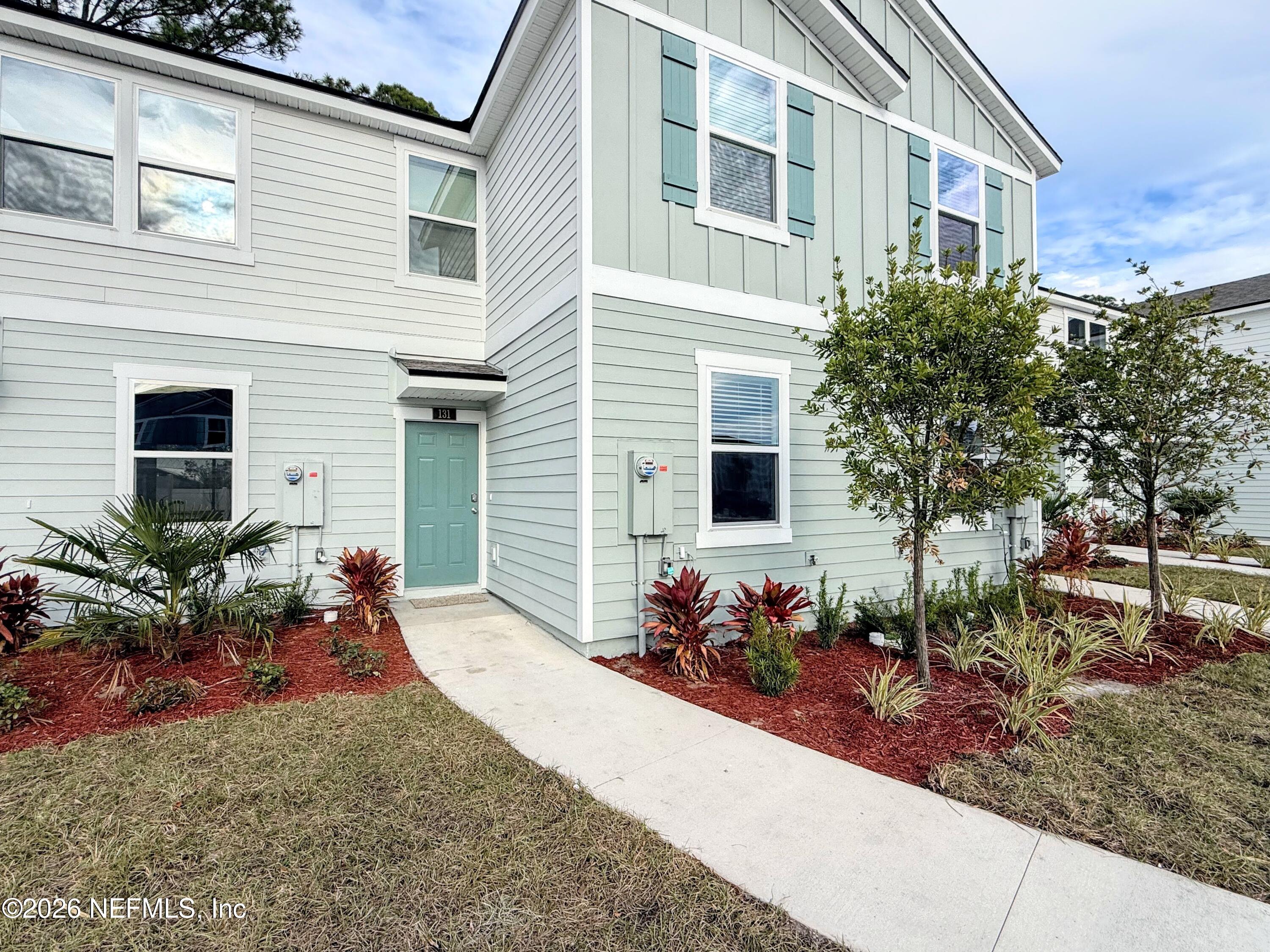 131 Palmetto Rdg Road St. Augustine, FL 32095 - Photo 21 of 22 a front view of a house with a yard