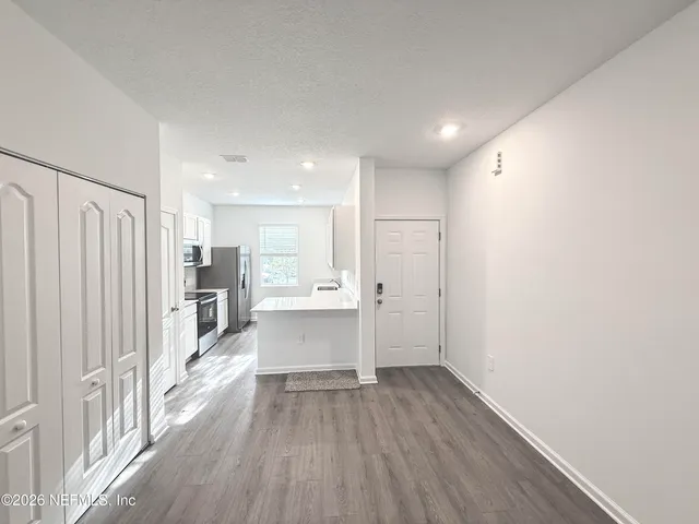 a view of kitchen with wooden floor