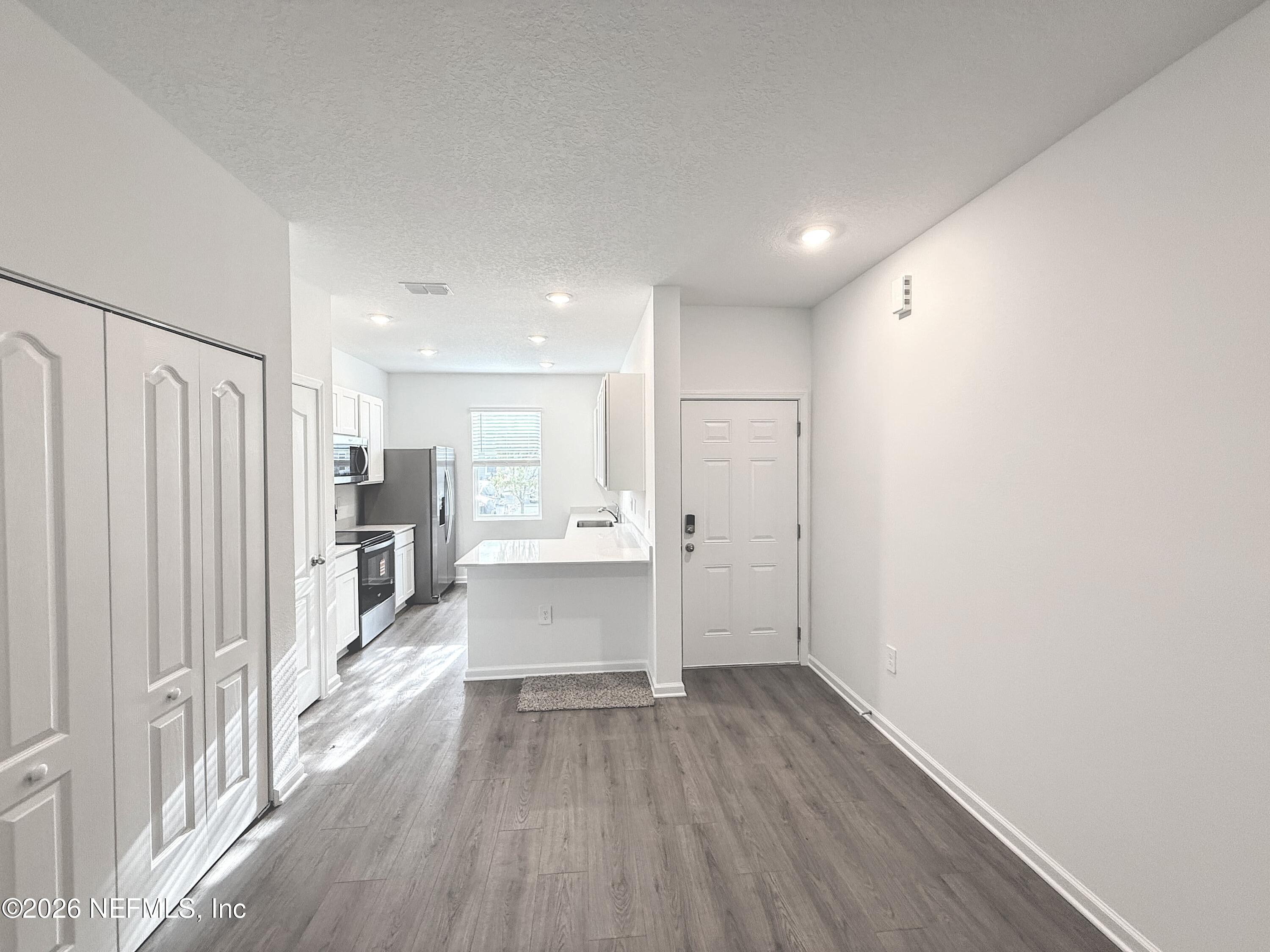 131 Palmetto Rdg Road St. Augustine, FL 32095 - Photo 3 of 22 a view of kitchen with wooden floor
