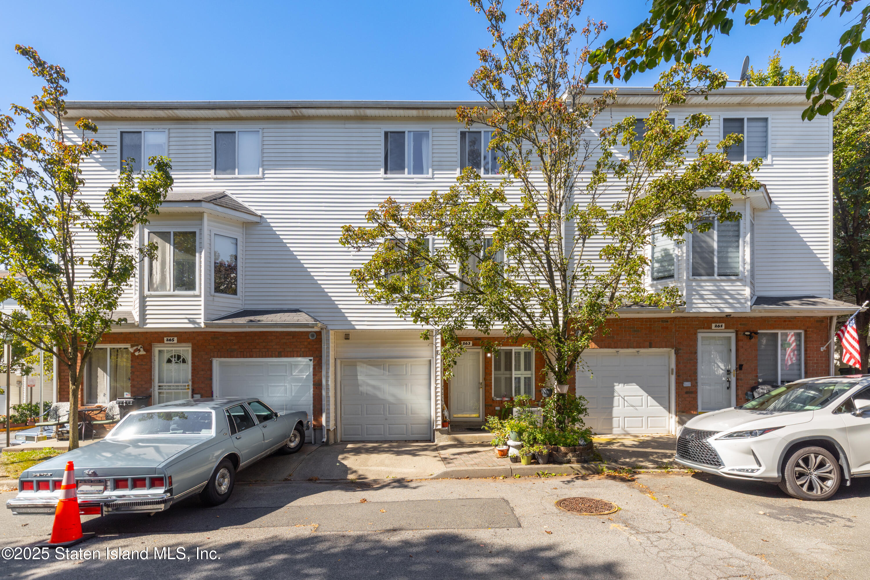 a front view of a house with parking space