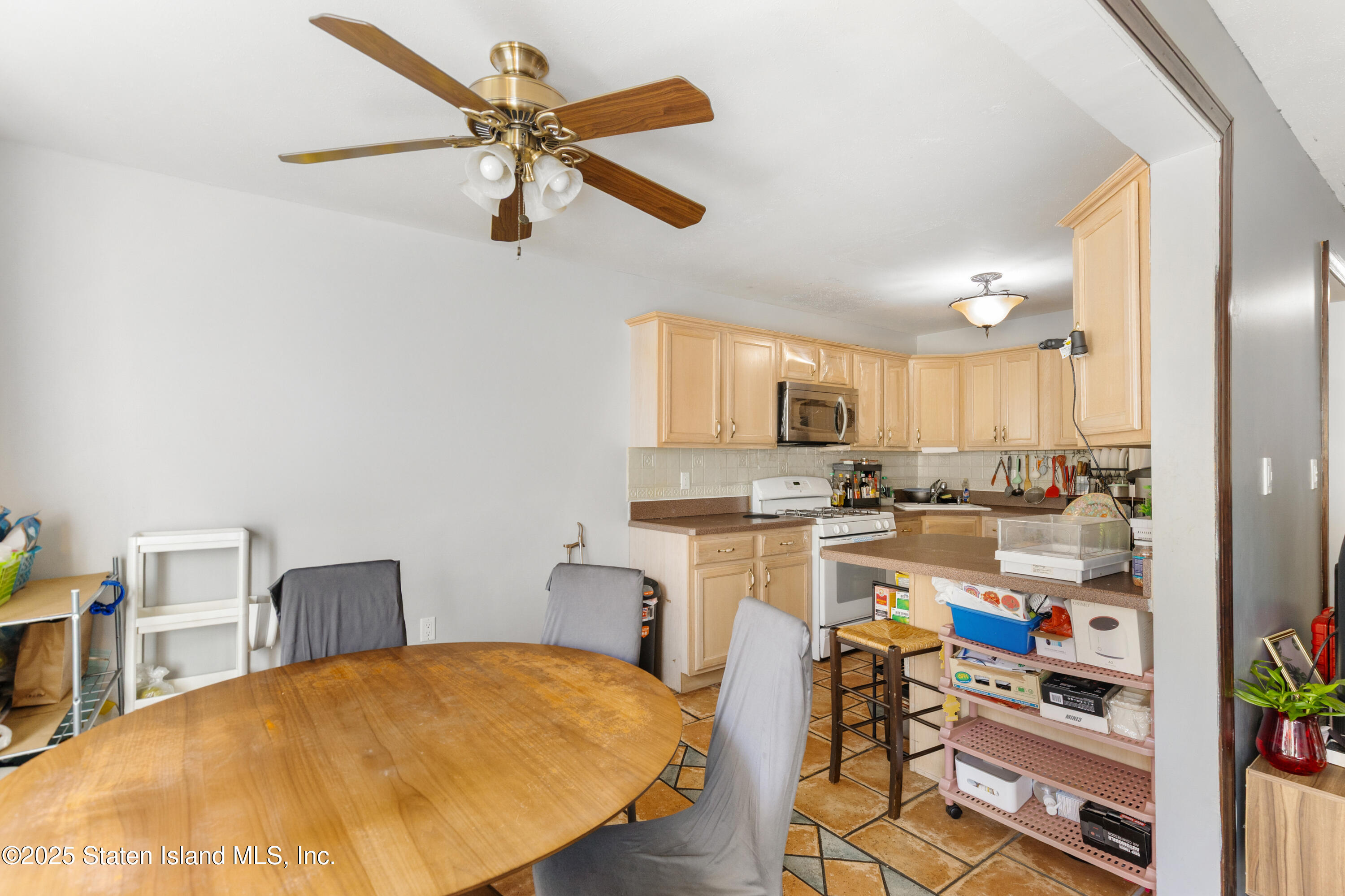 263 Jamie Lane Staten Island, NY 10312 - Photo 19 of 44 a open kitchen with cabinets and wooden floor