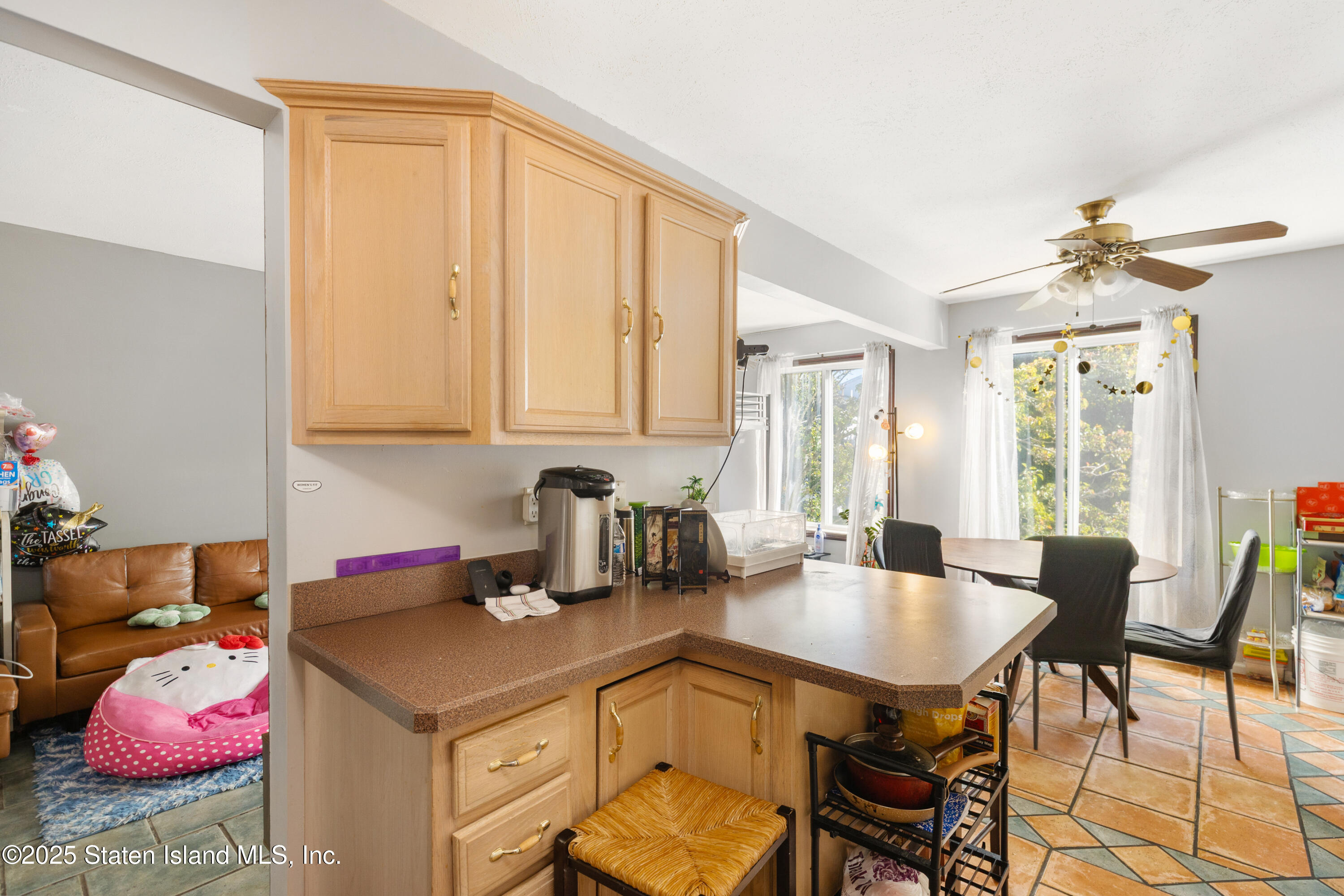 263 Jamie Lane Staten Island, NY 10312 - Photo 23 of 44 a kitchen with a table and chairs in it
