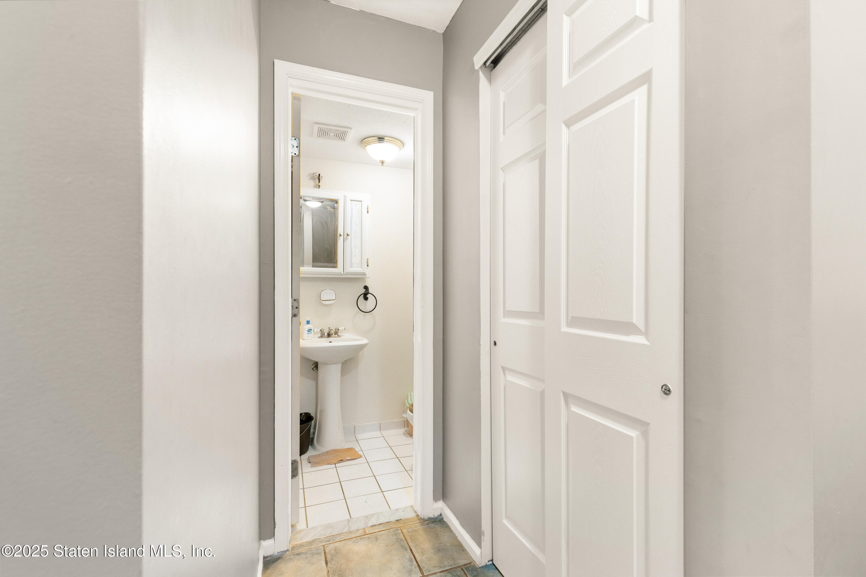 263 Jamie Lane Staten Island, NY 10312 - Photo 25 of 44 a bathroom with a glass door shower