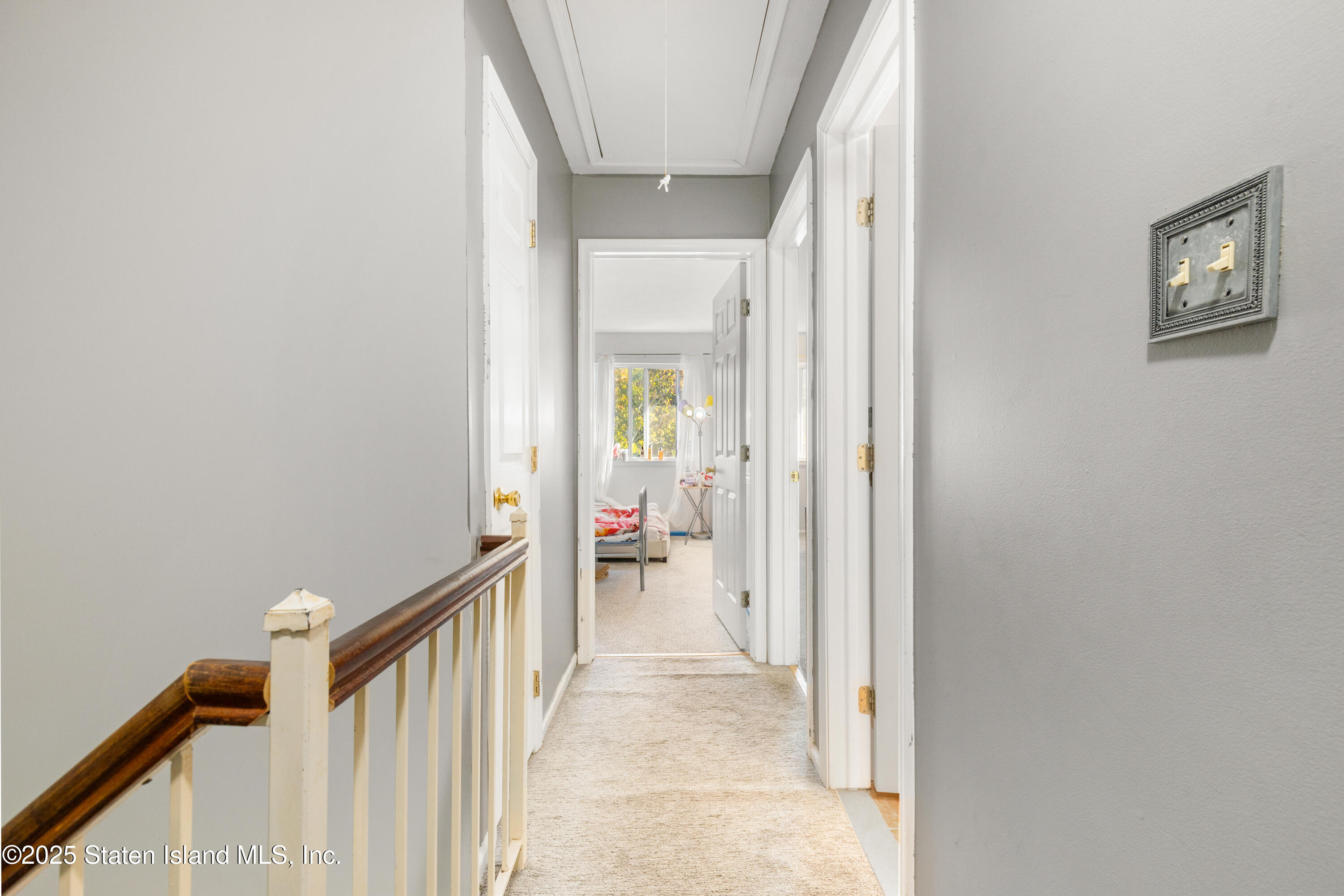 263 Jamie Lane Staten Island, NY 10312 - Photo 28 of 44 a view of a hallway view with wooden floor and staircase