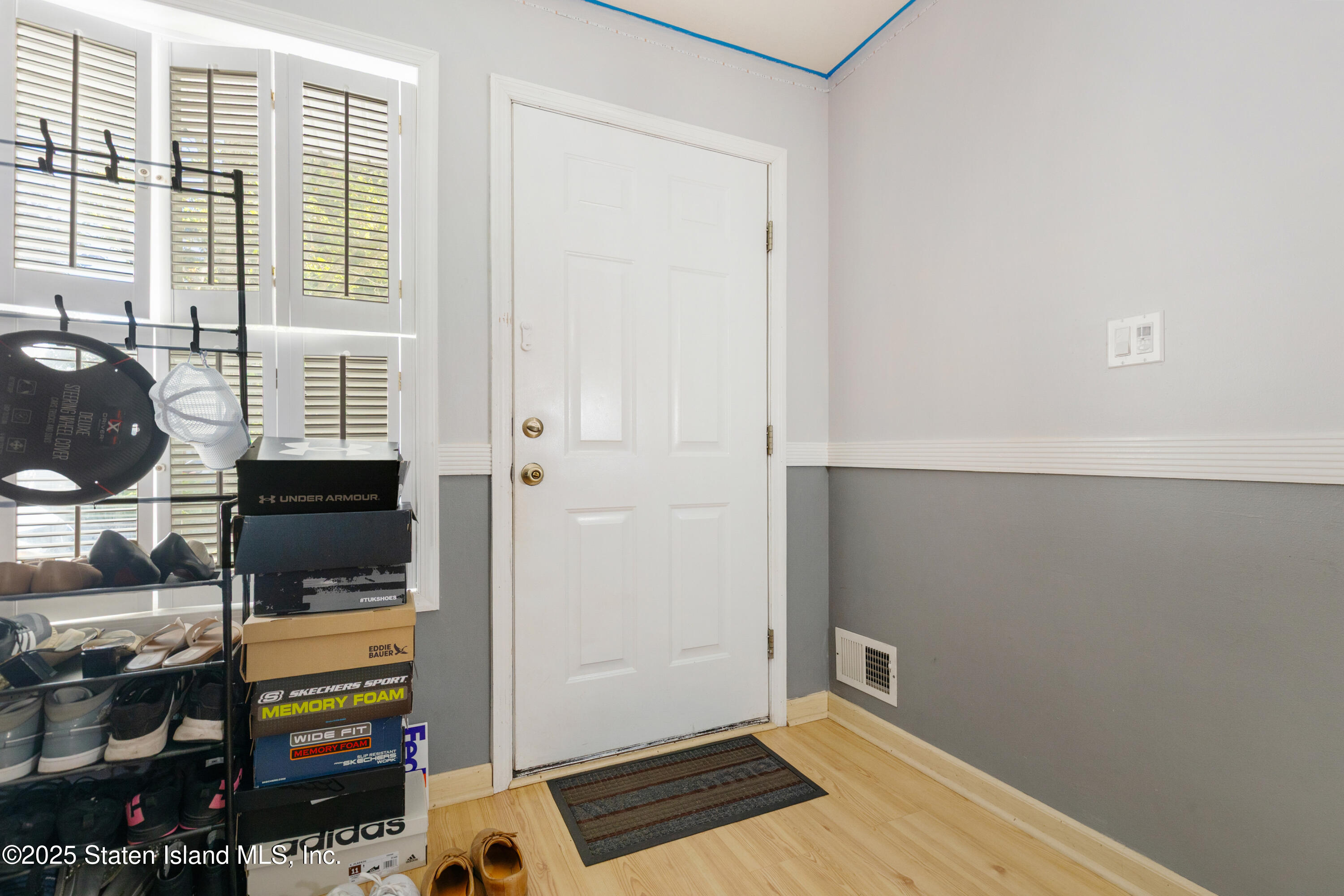 263 Jamie Lane Staten Island, NY 10312 - Photo 7 of 44 a view of livingroom with furniture and flat screen tv