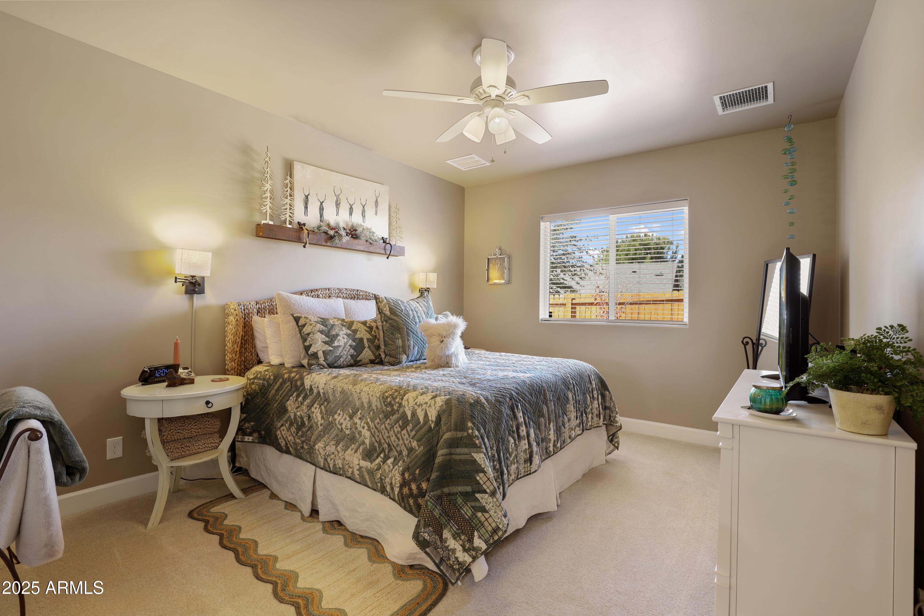 506 North Eagle Ridge Road Payson, AZ 85541 - Photo 14 of 41 a bedroom with a bed and a chandelier