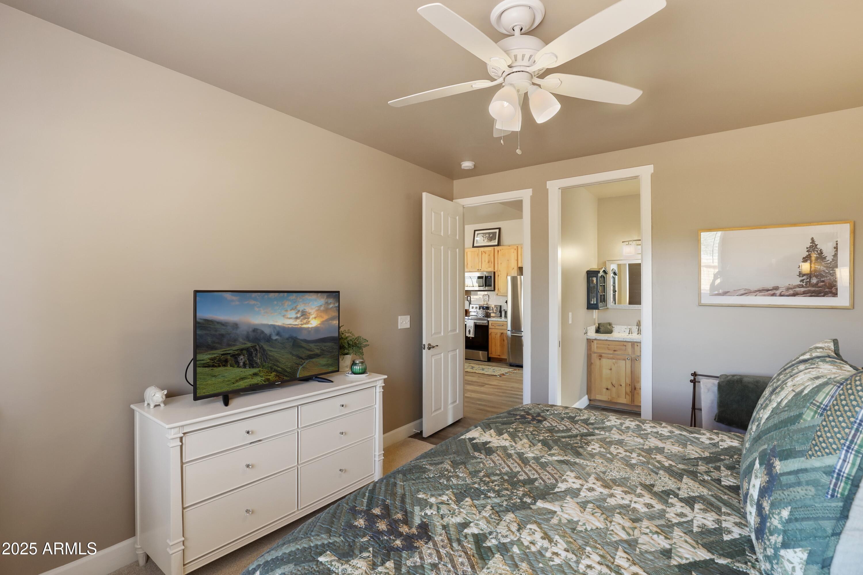 506 North Eagle Ridge Road Payson, AZ 85541 - Photo 15 of 41 a bedroom with a bed and a flat screen tv