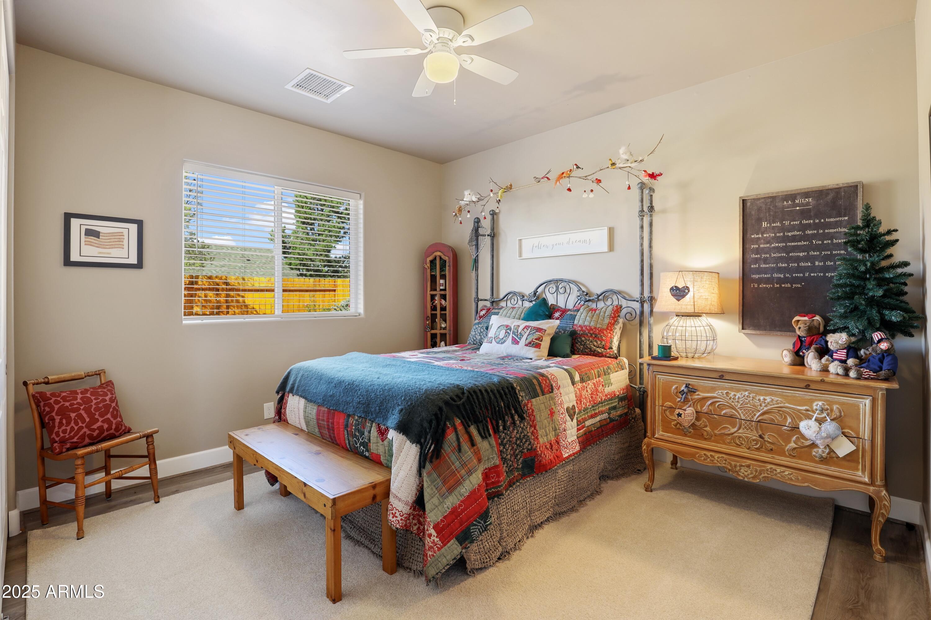 506 North Eagle Ridge Road Payson, AZ 85541 - Photo 19 of 41 a bed room with a bed and a couch