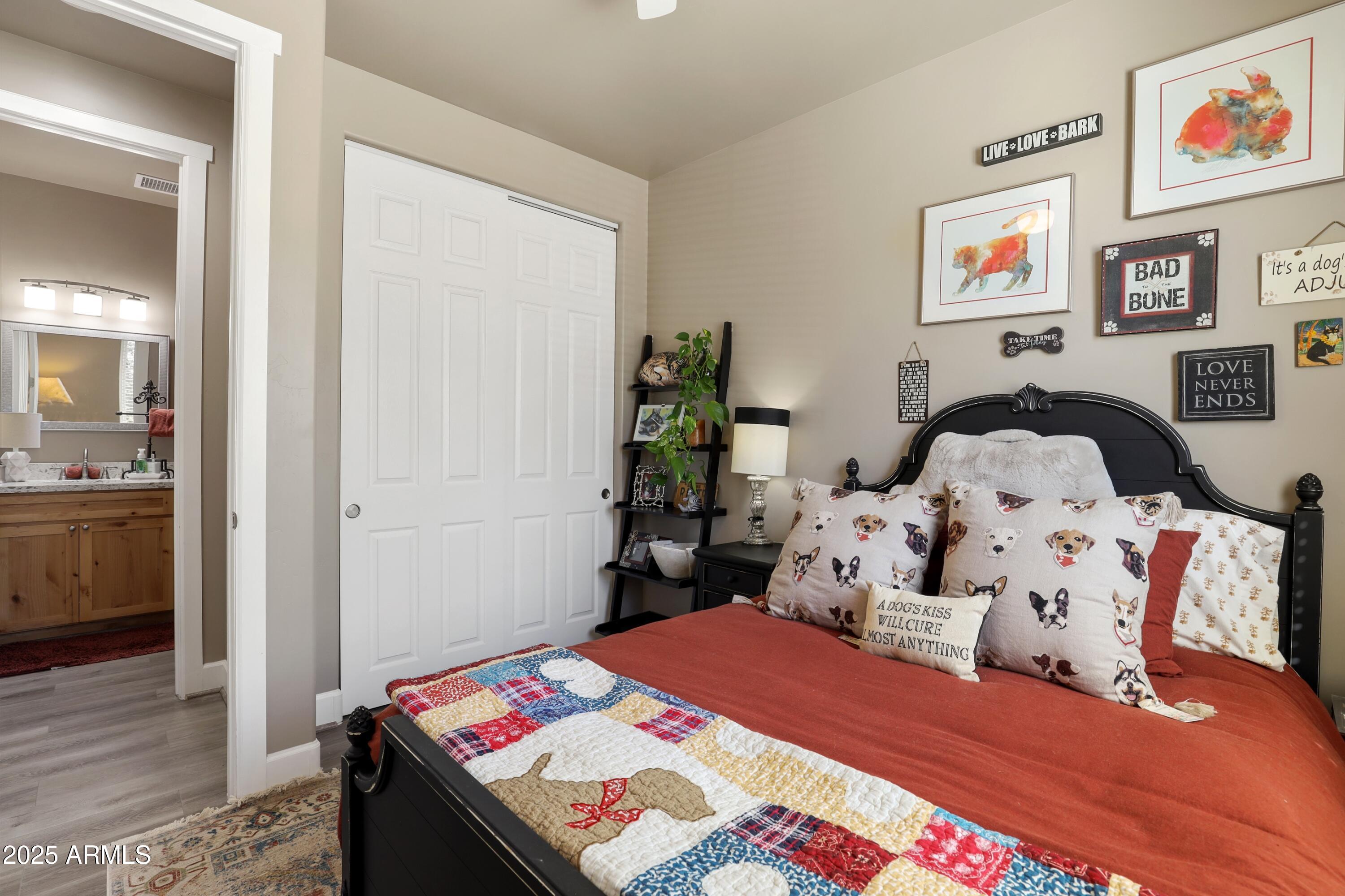 506 North Eagle Ridge Road Payson, AZ 85541 - Photo 22 of 41 a bed room with a bed and a painting on the wall