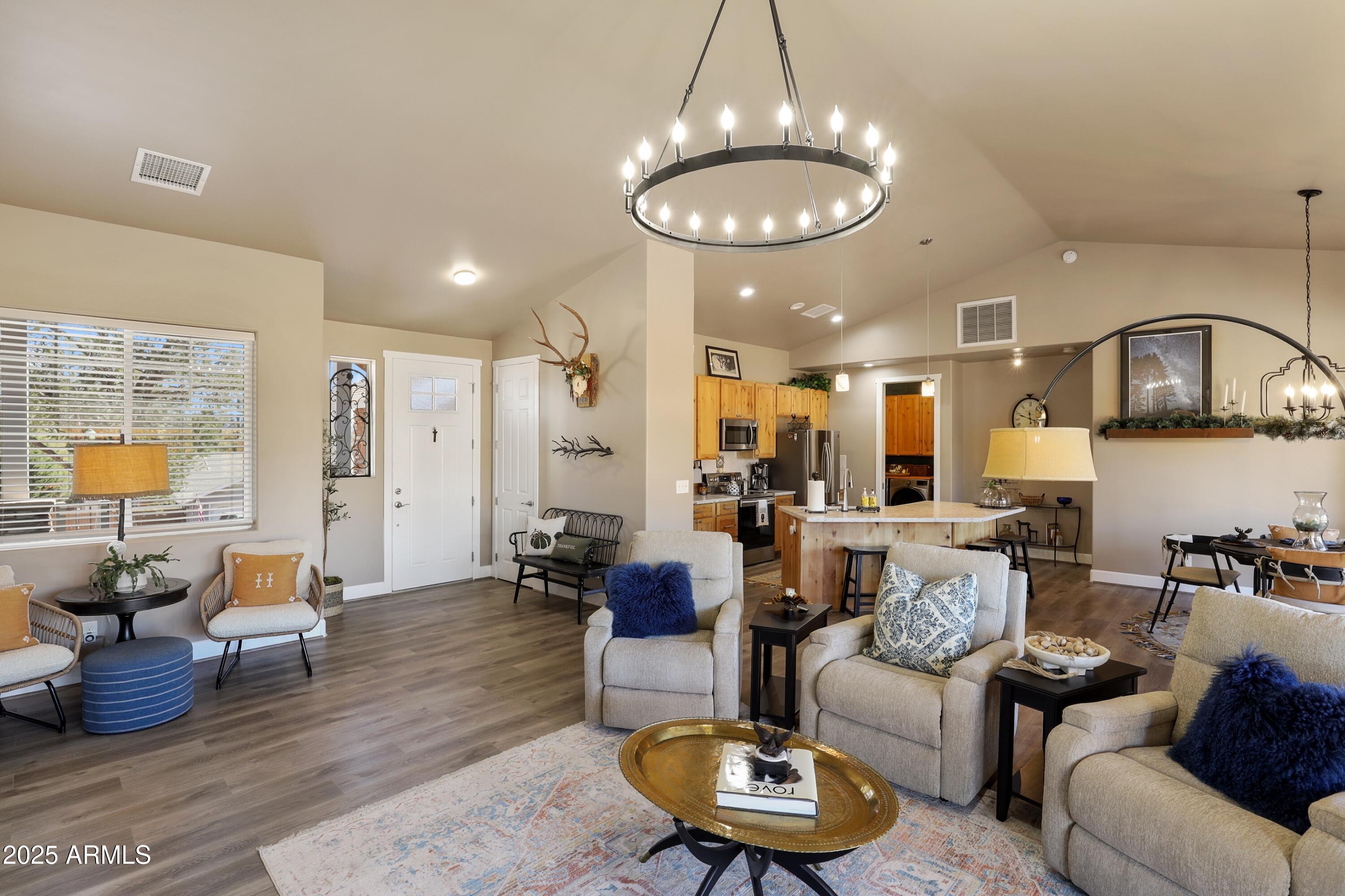 506 North Eagle Ridge Road Payson, AZ 85541 - Photo 5 of 41 a living room with furniture kitchen and a chandelier