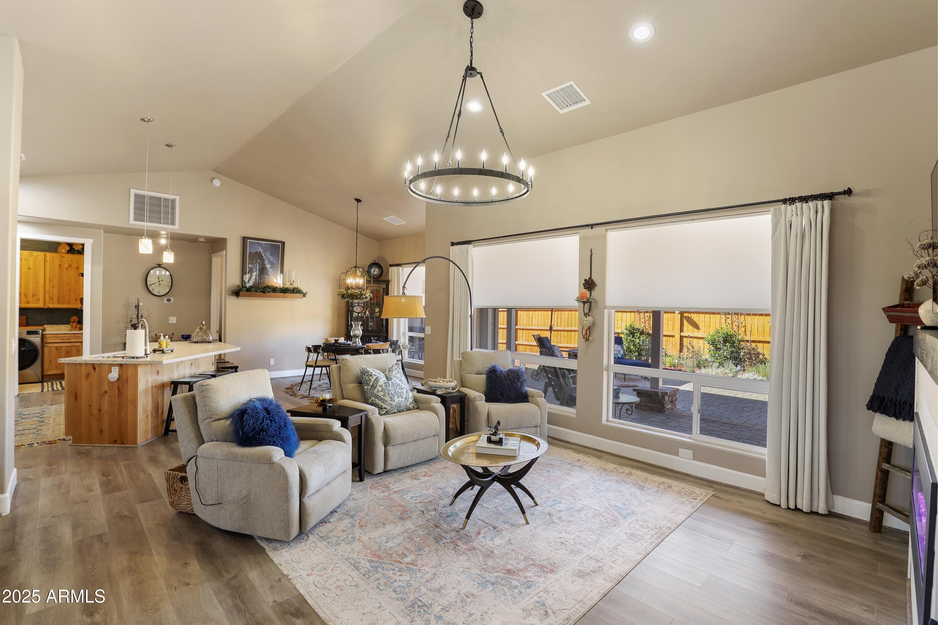 506 North Eagle Ridge Road Payson, AZ 85541 - Photo 6 of 41 a living room with lots of furniture and a chandelier