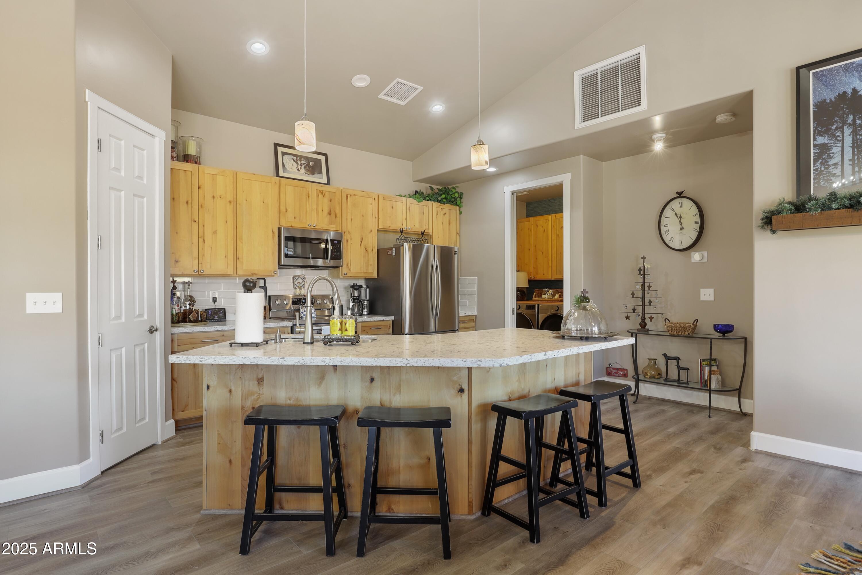 506 North Eagle Ridge Road Payson, AZ 85541 - Photo 9 of 41 a kitchen with a table and chairs in it
