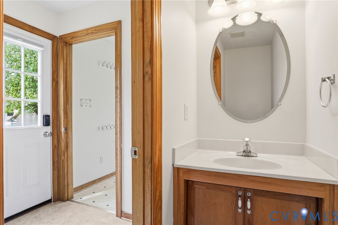 14420 Branding Iron Road Chesterfield, VA 23838 - Photo 18 of 50 Corner vanity with a white countertop and integrat