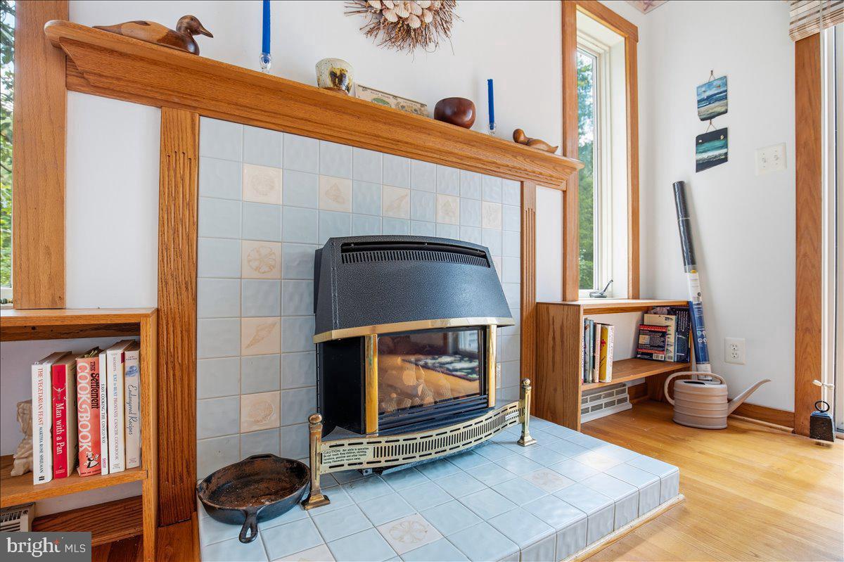 6110 Sheridan Point Road Prince Frederick, MD 20678 - Photo 52 of 77 Cozy fireplace with charming details.
