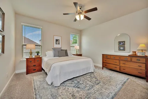 a bedroom with a bed and a dresser