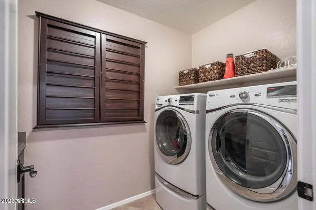 a utility room with dryer and washer
