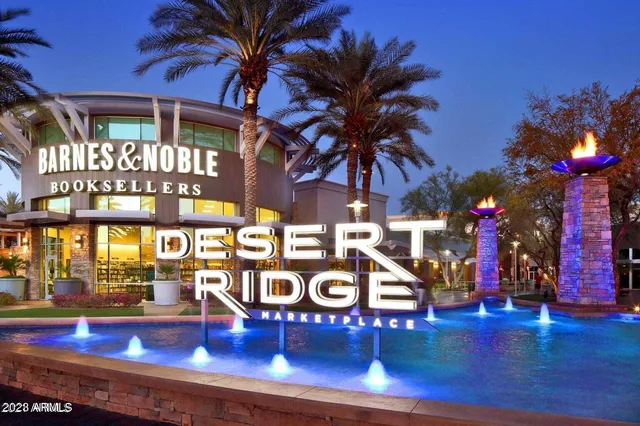 a view of multiple houses with swimming pool