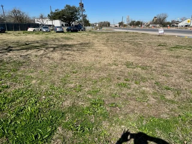 a view of a yard with an ocean