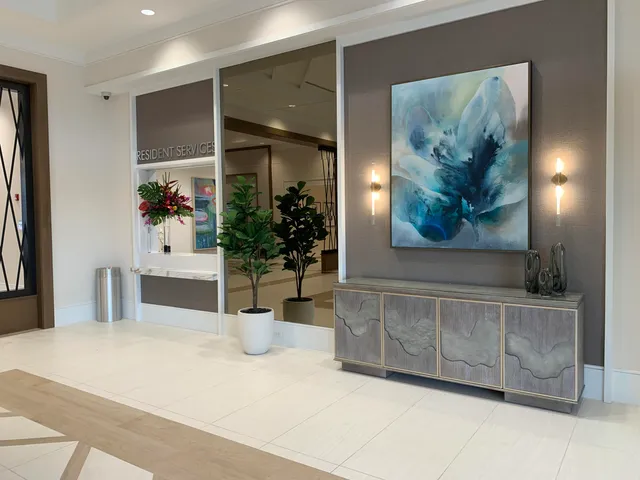 a view of a swimming pool with a table and chairs