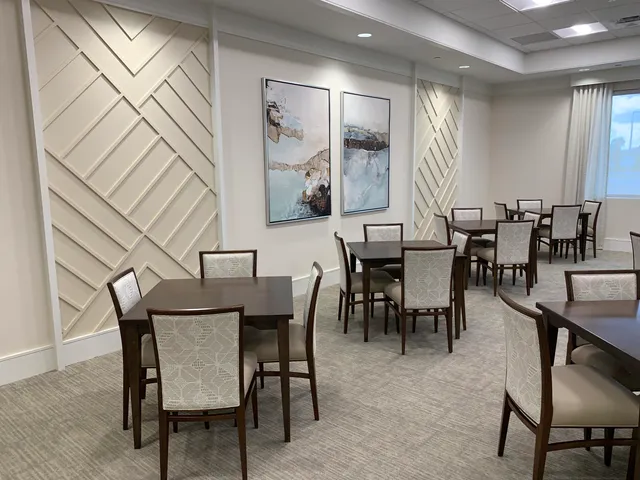 a view of swimming pool with outdoor seating and plants