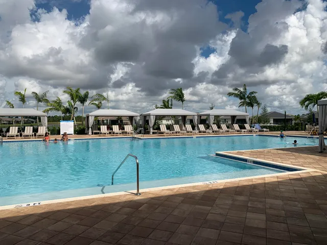 a view of a house with backyard porch and sitting area