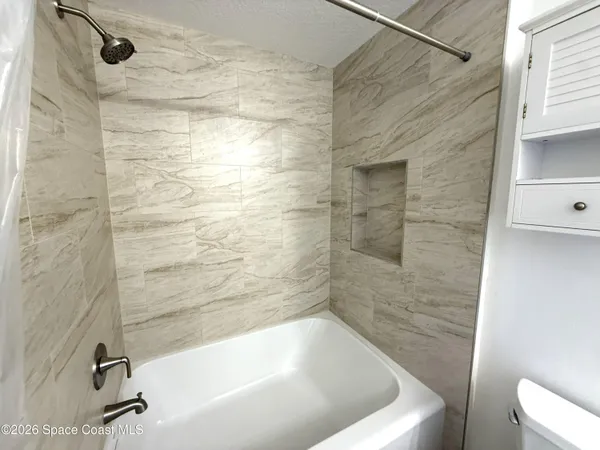 a view of a livingroom with wooden floor