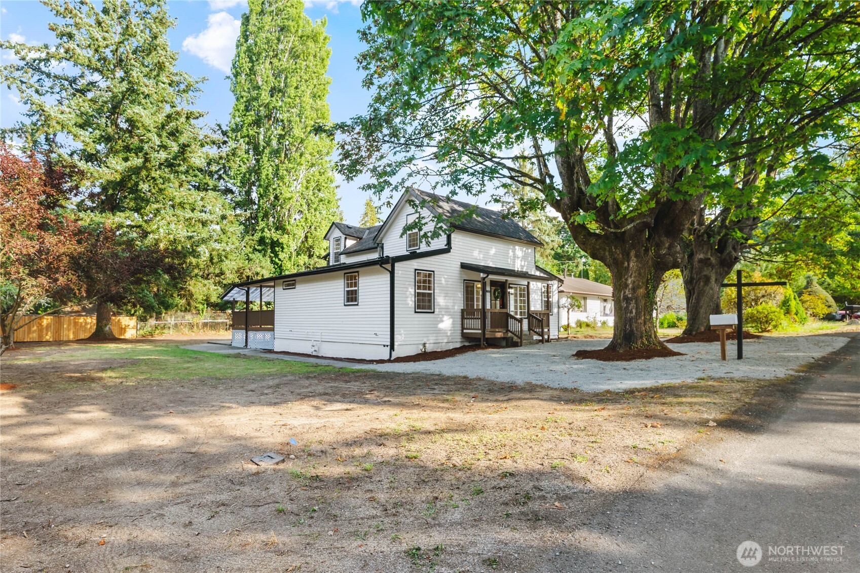 815 Blaine Street Steilacoom, WA 98388 - Photo 1 of 1 a house that has a tree in front of it