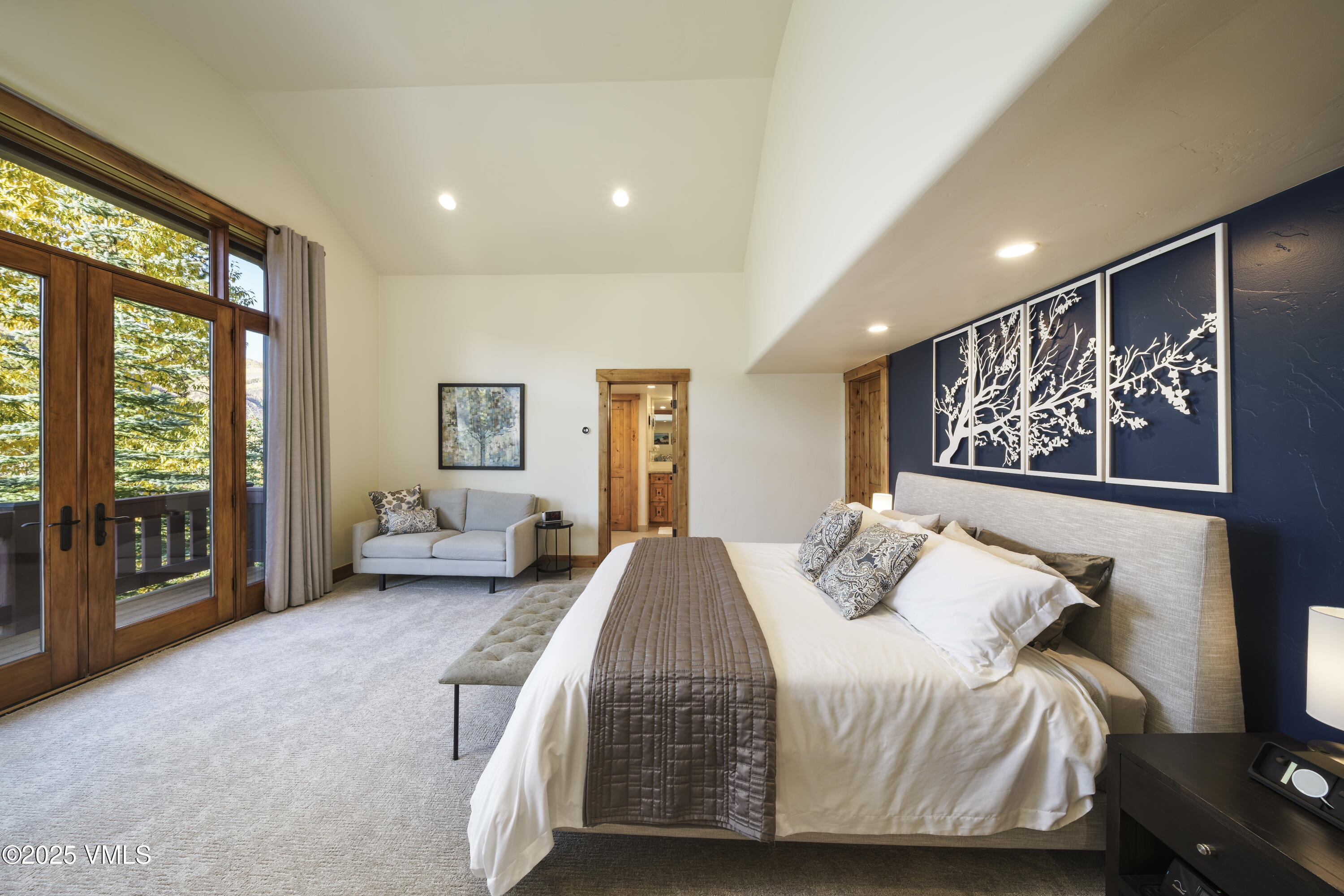 2735 Snowberry Drive, Unit B Vail, CO 81657 - Photo 14 of 48 a spacious bedroom with a large bed and a large window