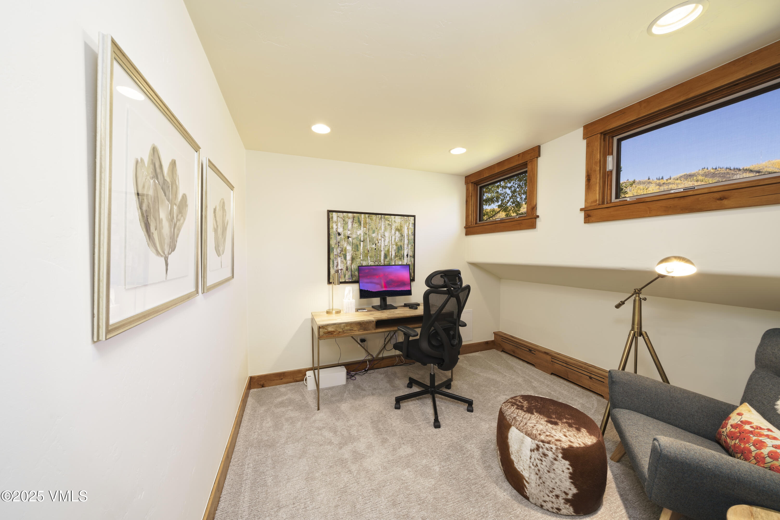 2735 Snowberry Drive, Unit B Vail, CO 81657 - Photo 18 of 48 a living room with furniture and paintings on the wall