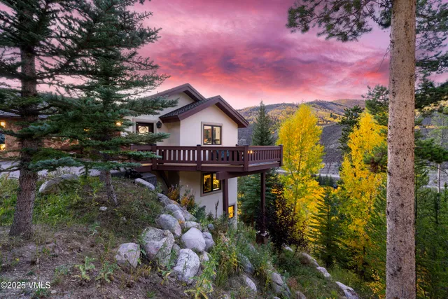a spacious bedroom with a large bed and a large window