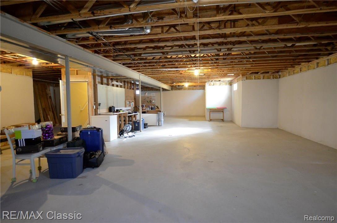 3232 Topview Court, Unit 56 Rochester, MI 48309 - Photo 21 of 27 Huge basement with exceptional high ceiling has many potential