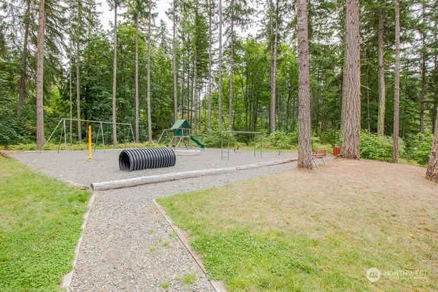 a street sign that is on a wooden wall
