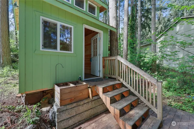 a view of a backyard with sitting area