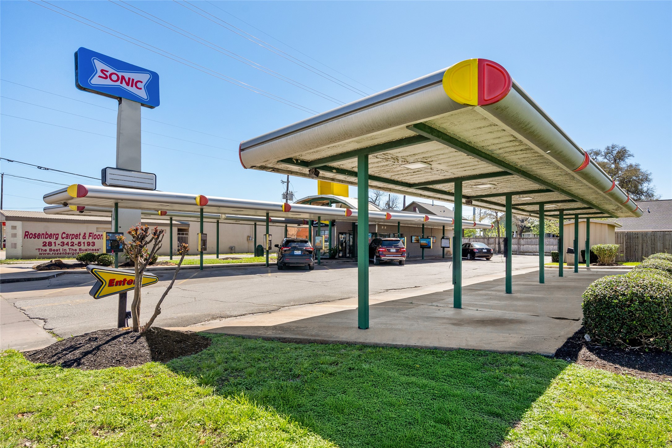 1004 Houston Street Rosenberg, TX 77471 - Photo 6 of 7 Located directly in front of the property, enjoy high visibility and easy access to popular local businesses like Sonic Drive-In and Rosenberg Carpet & Floor. Ideal for attracting foot and vehicle traffic to your own business or office space!