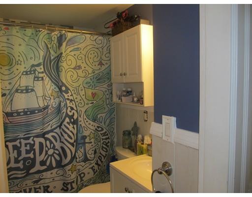 18 Arnold Road Sturbridge, MA 01518 - Photo 8 of 22 a bathroom with a bathtub and shower curtain