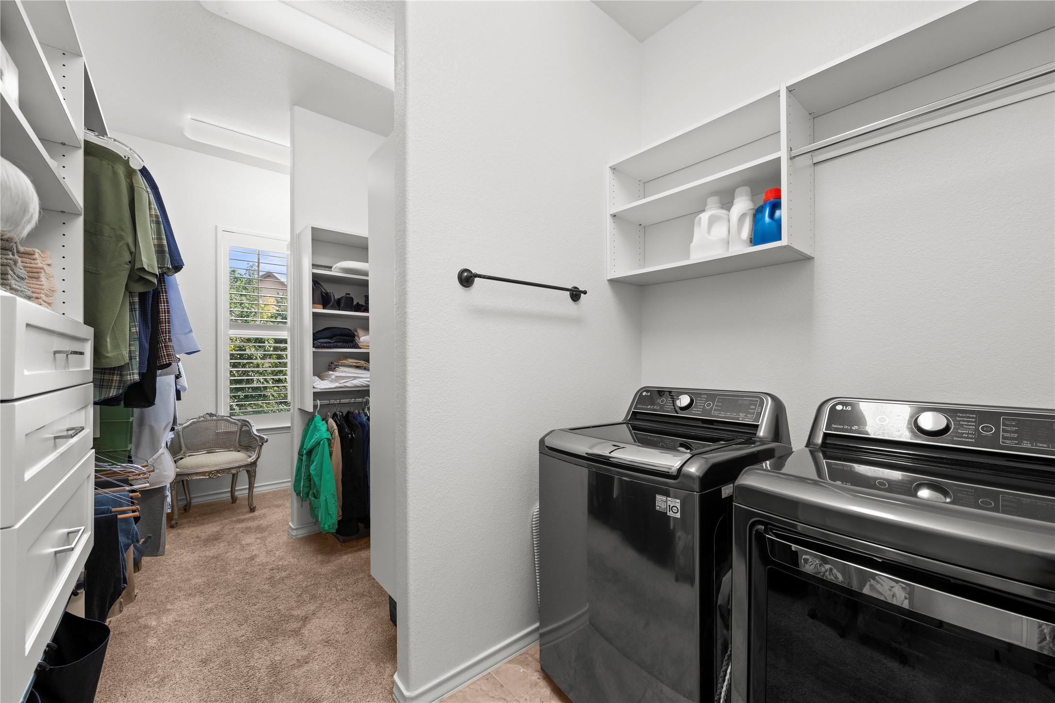 204 Adams Street Georgetown, TX 78628 - Photo 19 of 33 Functional laundry facilities seamlessly integrated with a spacious walk-in closet, simplifying daily routines.